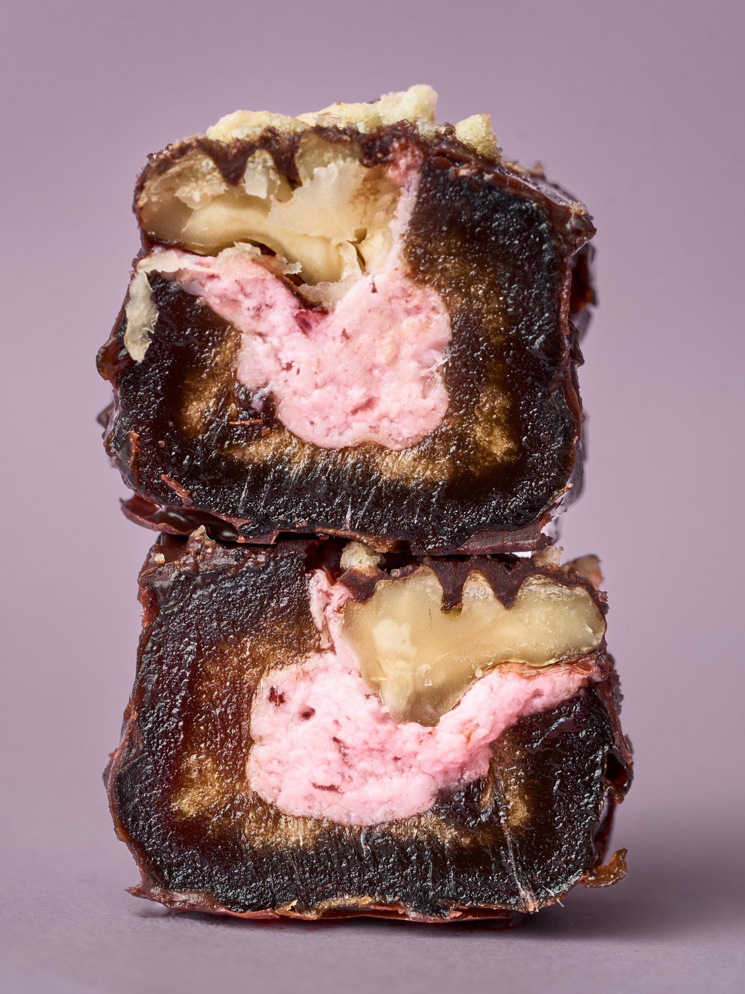 Two halves of a PITT Strawberry Yogurt date stacked, strawberry yogurt inside